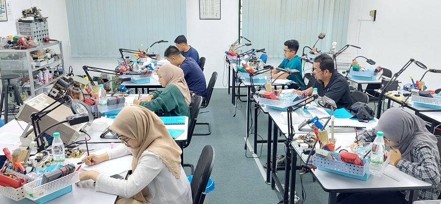 atsc staff attending electronics repair course