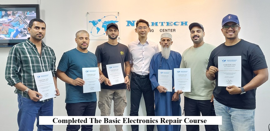 Oman Students Taking Electronics Repair Course
